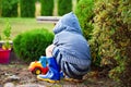 Boy playing with toy car outdoors Royalty Free Stock Photo