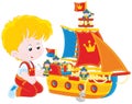 Boy playing a toy ship