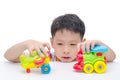 Boy playing toys over white Royalty Free Stock Photo