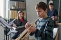 Boy Playing Trumpet In School Orchestra Royalty Free Stock Photo