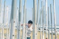 The boy playing and trying to find a way out of the maze of iron pipes