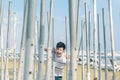 The boy playing and trying to find a way out of the maze of iron pipes Royalty Free Stock Photo