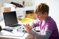 Boy Playing Video Game In Bedroom Royalty Free Stock Photo