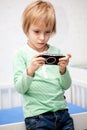 A boy playing a video game on his game console Royalty Free Stock Photo