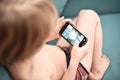 Boy playing video game on a mobile phone Royalty Free Stock Photo