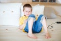 Boy playing video games on portable device Royalty Free Stock Photo