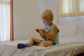 Boy playing video games on portable device Royalty Free Stock Photo