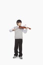 Boy playing the violin, studio shot Royalty Free Stock Photo