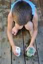 Boy playing with water and containers Royalty Free Stock Photo