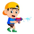 Boy playing with water gun Royalty Free Stock Photo