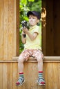 Boy Playing With Water Pistols In Park Royalty Free Stock Photo