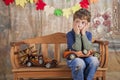 Boy playing with wooden toy cars. Royalty Free Stock Photo