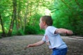 Boy playing in the woods Royalty Free Stock Photo