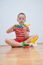 A boy plays with cubes