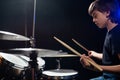 A boy plays drums in a recording studio Royalty Free Stock Photo