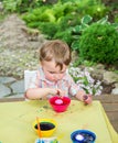 Boy Plays with a Easter Egg in Pink Dye Royalty Free Stock Photo