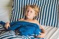 The cute boy woke up in his bed. Children sleep concept Royalty Free Stock Photo