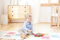 The boy plays in a kindergarten on the xylophone. boy playing with toy musical instrument xylophone in the children`s room. Close- Royalty Free Stock Photo