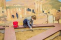 A boy plays a paleontologist, looking for ancient finds in the ground Royalty Free Stock Photo