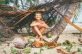 Boy plays in Robinzon on tropical beach in hut of branches