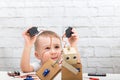 boy plays with the robot and servo