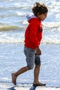 Boy plays at the seaside Royalty Free Stock Photo