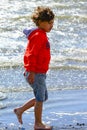 Boy plays at the seaside Royalty Free Stock Photo