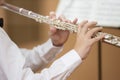 The boy plays the shining flute Royalty Free Stock Photo