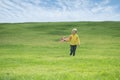 A boy plays in a toy red plane Royalty Free Stock Photo