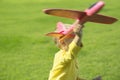 A boy plays in a toy red plane Royalty Free Stock Photo