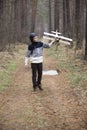 A boy plays in the woods with a toy plane. autumn games in the w Royalty Free Stock Photo