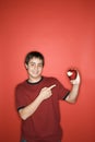 Boy pointing to eaten apple. Royalty Free Stock Photo