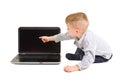 Boy points finger at the screen of laptop Royalty Free Stock Photo