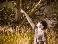 Boy Points at the Solar Eclipse Wearing Paper Glasses Royalty Free Stock Photo