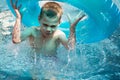 Boy in pool splashing