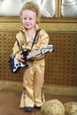 Boy in pop retro suit playing the guitar Royalty Free Stock Photo