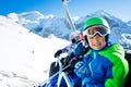 Boy portrait smile on ski chairlift over mountain Royalty Free Stock Photo