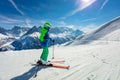 Boy portrait on snow slope over mountain peaks Royalty Free Stock Photo