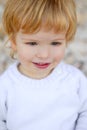 Boy portrait winter outdoor, stones background