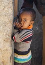 Boy posing in the entrance of a house city of Jugol. Harar. Ethiopia.
