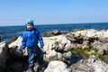 Boy posing on shore of black sea Royalty Free Stock Photo