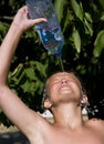 Boy pouring water on himself Royalty Free Stock Photo