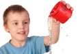 Boy pours out water