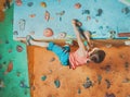 Boy practicing in climbing gym Royalty Free Stock Photo
