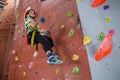 Boy practicing rock climbing in fitness studio Royalty Free Stock Photo