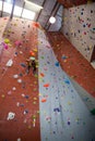 Boy practicing rock climbing in fitness studio Royalty Free Stock Photo