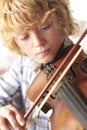 Boy Practicing Violin At Home