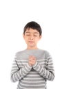 Boy praying meditating on white background