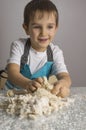 Boy is prepearing pizza dough Royalty Free Stock Photo