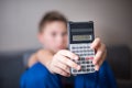 Boy presenting calculator Royalty Free Stock Photo